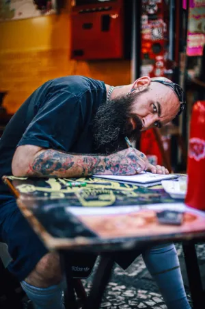 Tattooed Artist Sketching