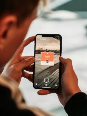Person Holding Smartphone With Instagram Feed