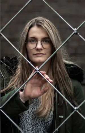 Girl Behind Chain Link Fence
