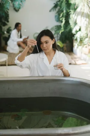 Woman In White Shirt By Water