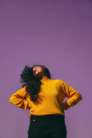 Yellow Sweater On Purple Background