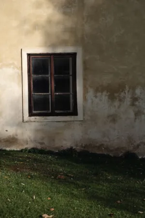 Old Window On Weathered Wall