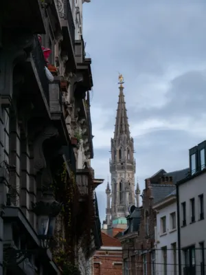 Gothic Tower Amidst Urban Buildings