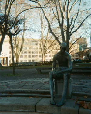 Sitting Statue In A Park