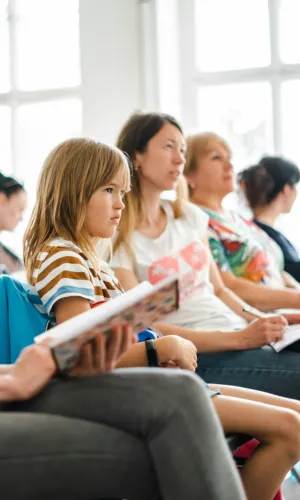 Children And Adults In A Classroom Setting