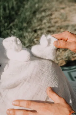 Baby Booties On Pregnant Belly