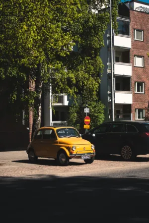 Vintage Car On Cobblestone Street