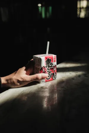 Hand Holding Japanese Drink