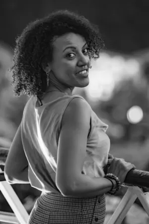 Curly-Haired Woman In Black And White