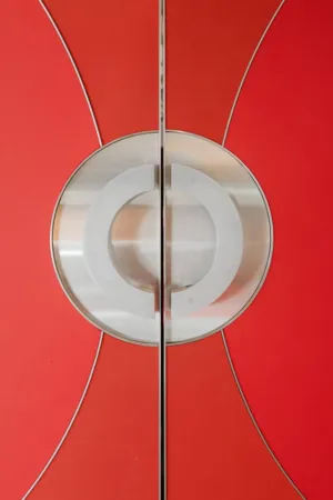 Red Door With Circular Emblem