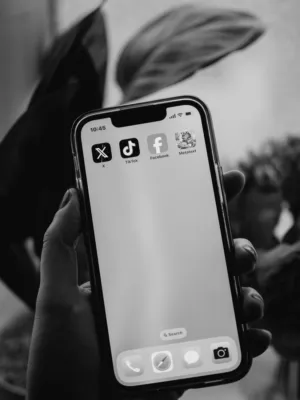 Hand Holding Smartphone With Social Apps
