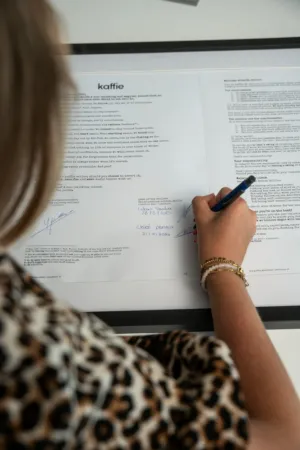 Person Writing On Document