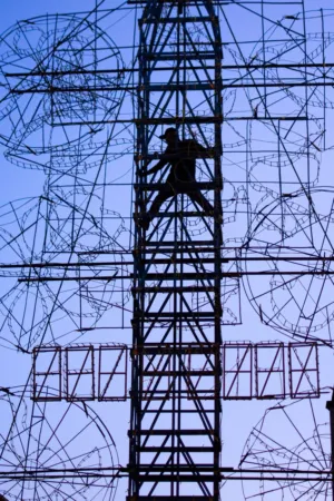 Silhouette Of A Person Climbing A Tower