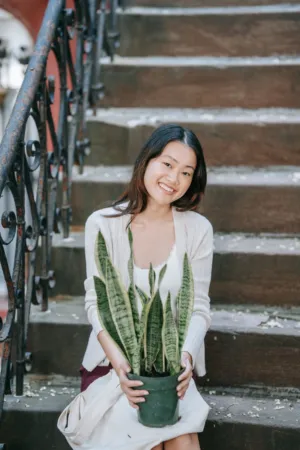 Young Woman With Plant