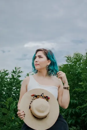 Blue-Haired Woman With A Hat