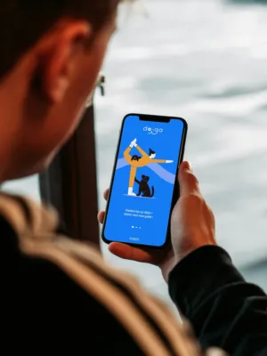 Person Using A Mobile App With A Yoga And Dog Illustration