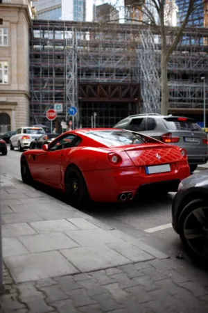Red Ferrari On City Street