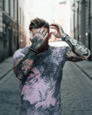 Tattooed Man In Urban Setting