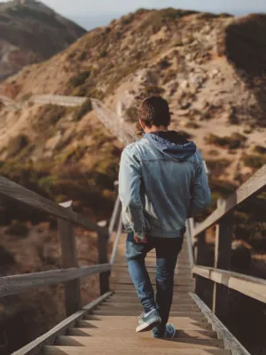 Man Walking Down Stairs In Nature