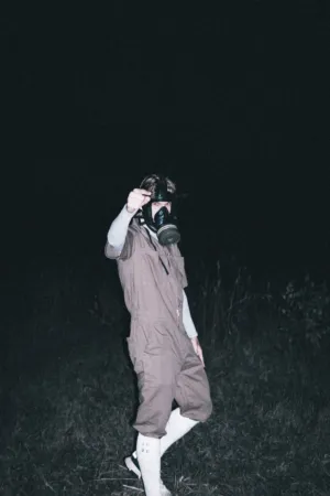 Person In Gas Mask And Coveralls
