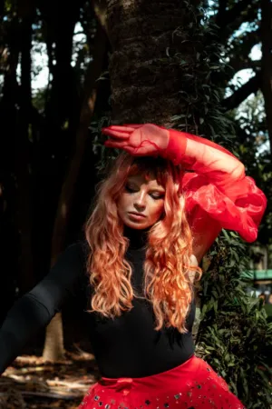 Red Haired Model In Forest