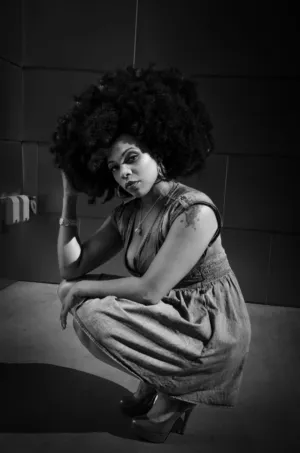Crouching Woman With Afro