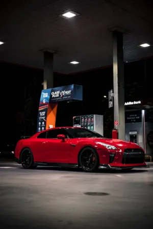 Red Sports Car At Gas Station