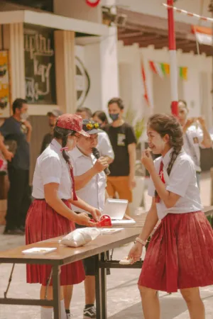 Schoolgirls Eating At An Outdoor Event