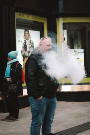 Man In Black Jacket With Smoke