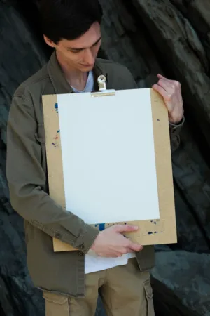 Man Holding Blank Canvas