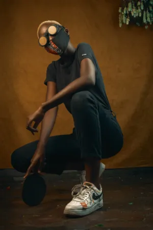 Crouching Figure With Goggles And Mask