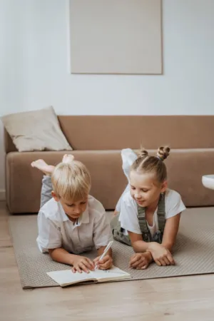 Children Drawing On Floor