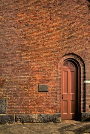 Brick Wall With Arched Door
