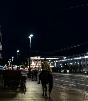 Nighttime Cityscape With Horse Rider