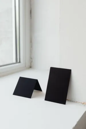 Black Cards On A Window Sill