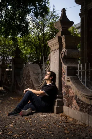 Man Resting On Stone Wall
