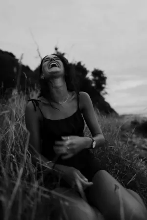 Black And White Portrait Of A Woman Laughing