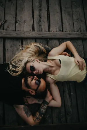 Romantic Couple Laying On Wooden Deck
