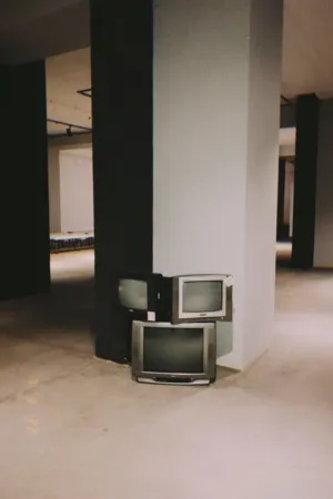 Stacked Tvs In An Empty Room