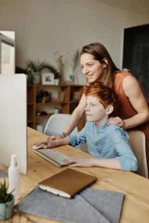 Mother And Son At Computer