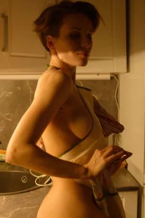 Nude Woman In Kitchen