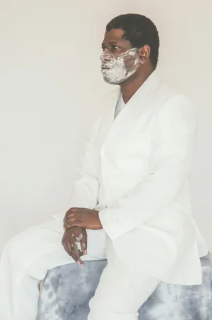Man In White Suit With Powdered Face