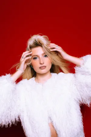 Blonde Model In White Fur Coat