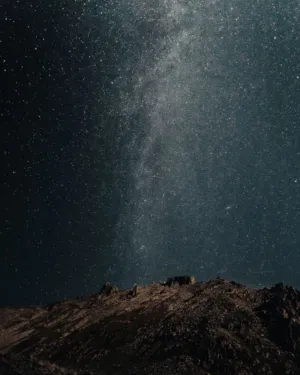 Starry Night Sky Over Mountains
