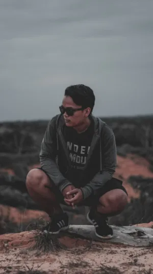 Crouching Man In Nature