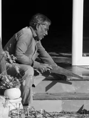 Man Sawing Wood