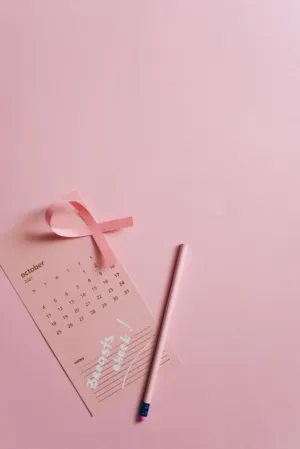 Pink Calendar With Pink Ribbon And Pencil