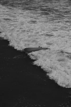 Surfboard In The Surf