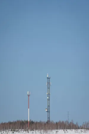 Communication Towers In Winter Landscape
