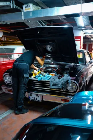 Mechanic Working On A Classic Car
